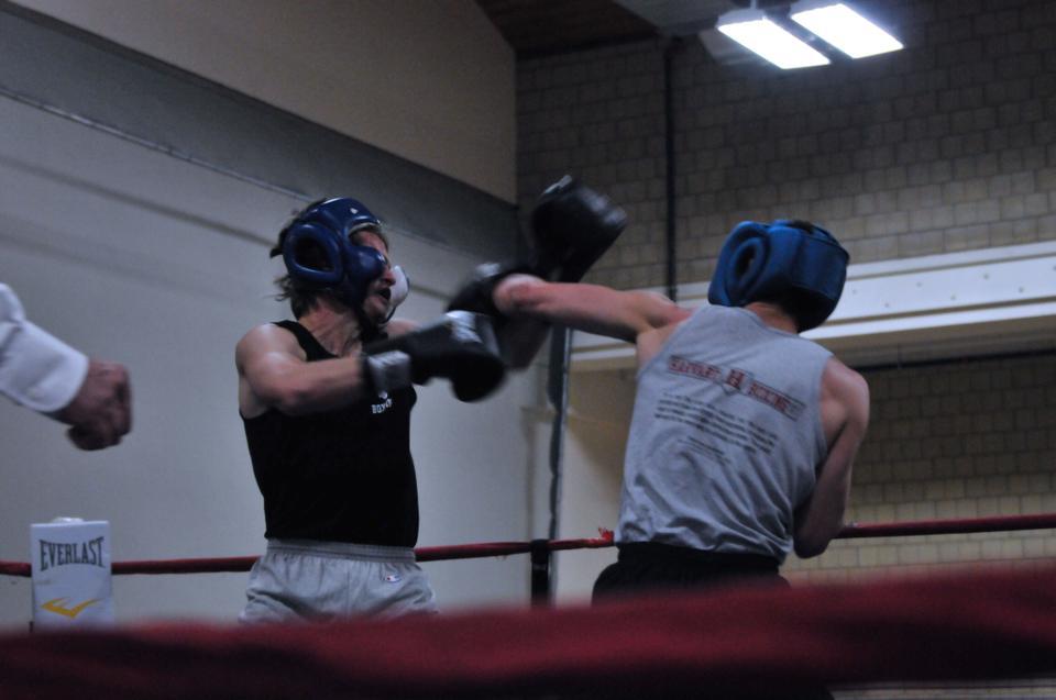 George "Halfblood" Hageman '12 delivers a hook to the jaw of Jay "Blood" Brooks '14 at the Harvard Boxing Club's fourth annual Kenneth Moskow Memorial Fight Night at the QRAC. The exhibition featured seventeen matches, each composed of three rounds of two minutes each. 
