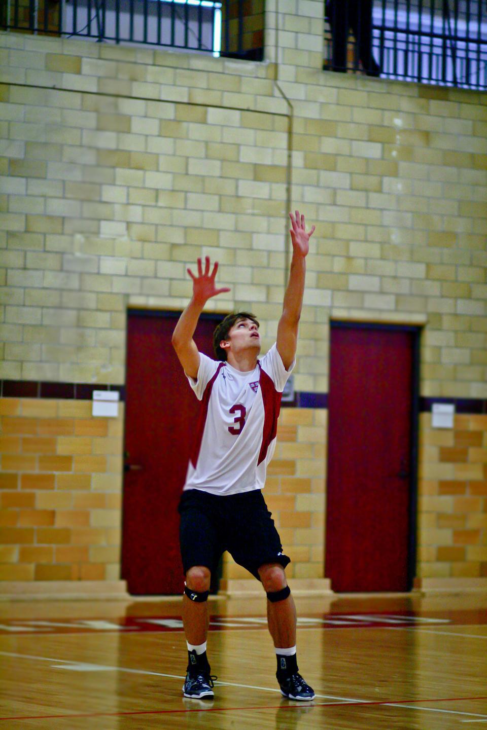 The Crimson defense, including freshman Will Chambers, shown above in earlier action, was unable to stop the George Mason attack on Thursday. Harvard fell to the Patriots in straight sets, which eliminated the squad from the Eastern Intercollegiate Volleyball Association Playoffs.