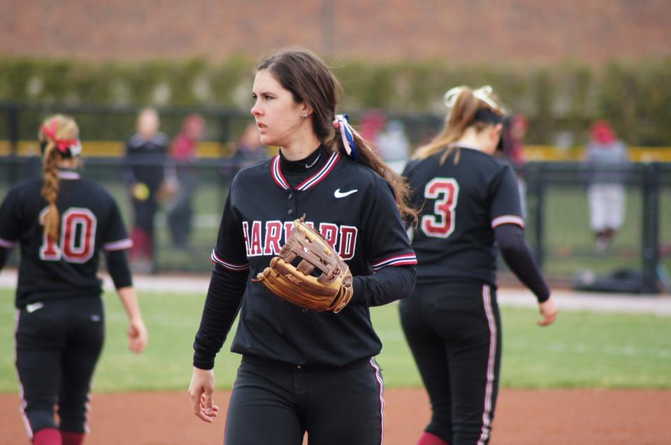 Sophomore third baseman Kasey Lange, pictured above in earlier action, led the high-powered Crimson offense past Holy Cross on Thursday, finishing with four hits in the matchup. Senior pitcher Rachel Brown delivered a standout performance, blanking the Crusaders in seven innings.
