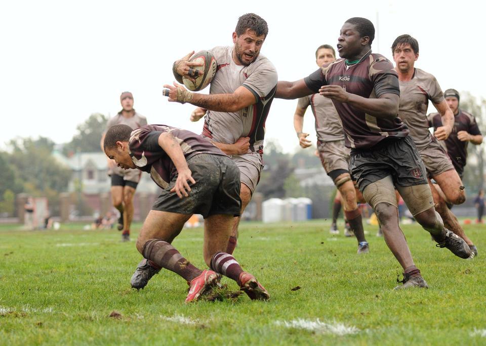 Obi Okwara ’12 (right) helps take down a player from Brown in a rugby game on October 1, 2011. Complaining about the rugby field shown here, players hope to raise the money to construct a new facility.
CORRECTION: May 2
An earlier version of this photo caption incorrectly stated that the field shown in the photograph will be replaced. In fact, the team hopes to raise money to build a new field.