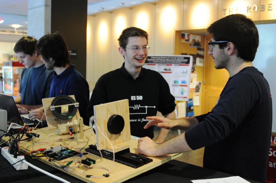 Eliot G. Silva ‘15 and Richard J. Saliba ‘15 showcase their original design, a controllable laser machine capable of writing and drawing via a vibrating laser.
