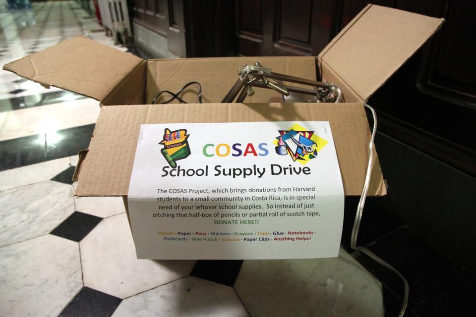 A COSAS box in Adams House holds donated student items. The COSAS project, supported by Adams House, Harvard Recycles, and other organizations, gathers goods to be sent to a small town in Costa Rica.