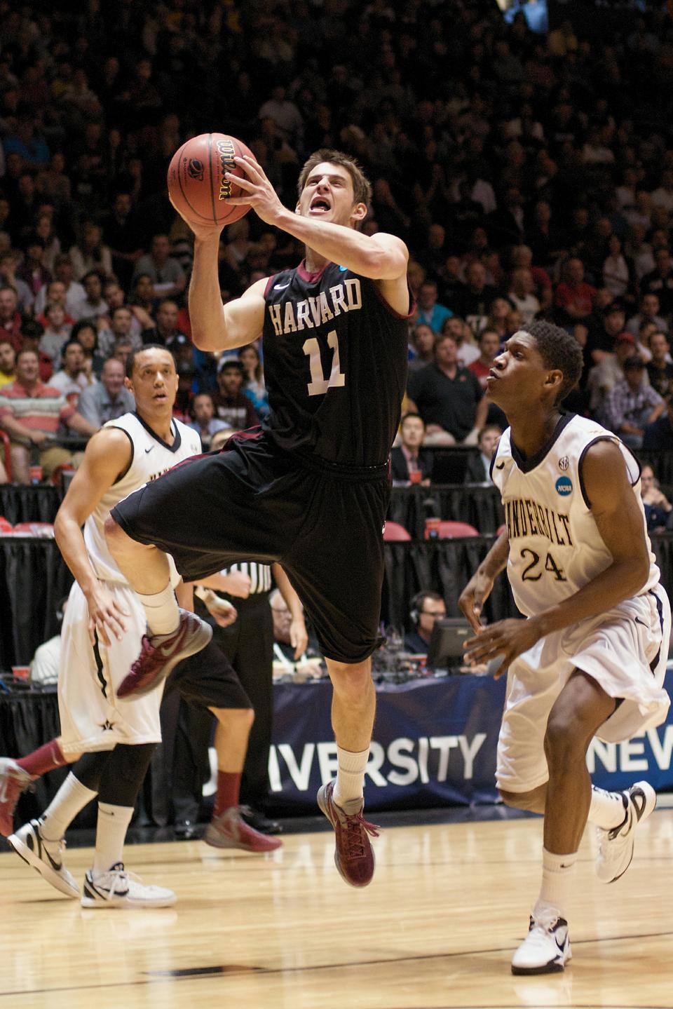 Co-captain guard Oliver McNally attacks the basket during the Harvard men's basketball team's matchup with Vanderbilt in the second round of the NCAA tournament on March 15. It was the Crimson's first NCAA tournament appearance since 1946. 