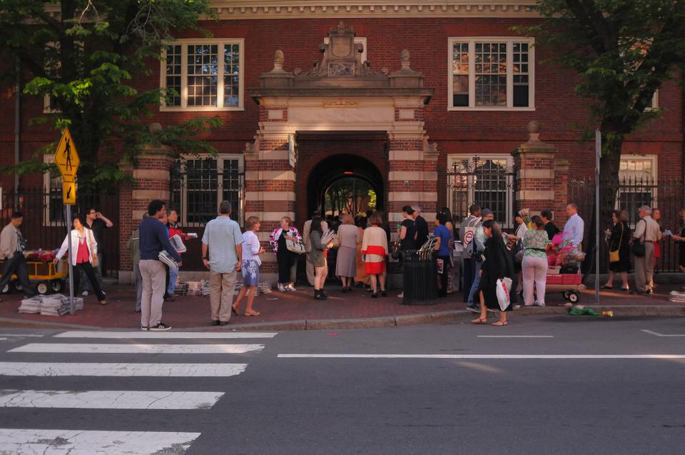 Students, friends, and family flood the yard at 7:00 AM on Thursday in order to find seats for the morning exercises. Ticket-holders had been waiting outside of the gates as early as 5:00 AM. 