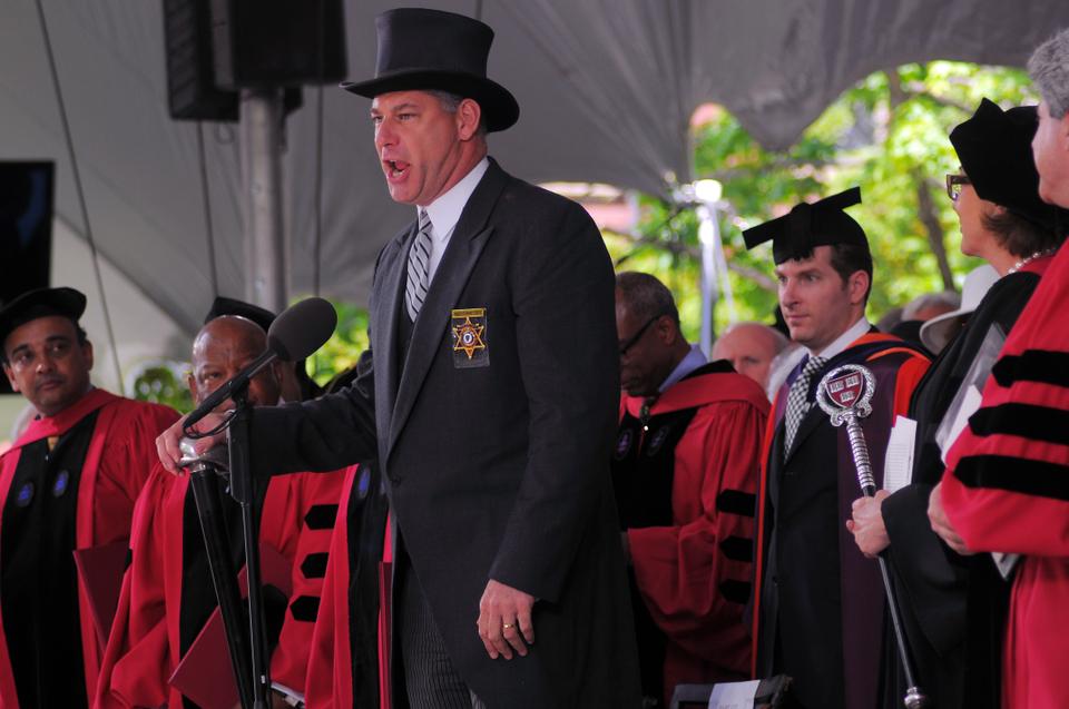 Peter J. Koutoujian, the Sheriff of Middlesex County, rises to adjourn the Commencement exercises. The Sheriff's formal orations of the start and dismissal of Commencement is a tradition that dates back to the seventeenth century.