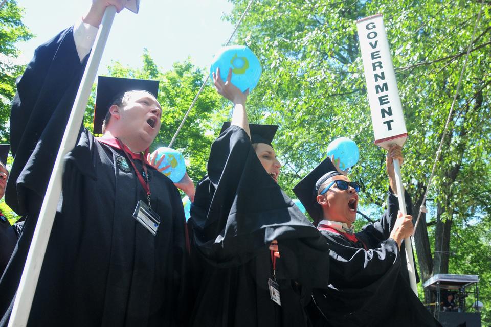 Graduates from the Kennedy School of Government cheer in excitement after being officially commenced by President Faust on Thursday morning. The 361st Commencement took place in Tercentary Theatre.