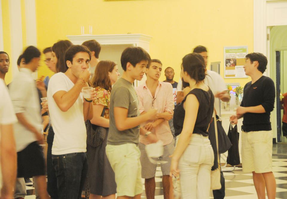 Harvard students enjoy free food and beverages at  Woodstock on the Block, a concert in Lowell Dining Hall on Saturday night. The event was thrown by CAARE, DAPA, and SMHL.