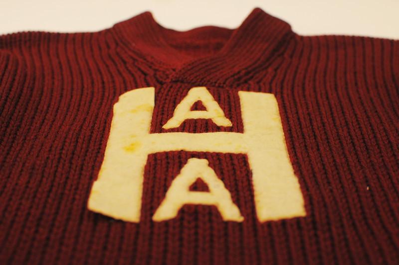 A Harvard Athletic Association sweater commonly worn to games.