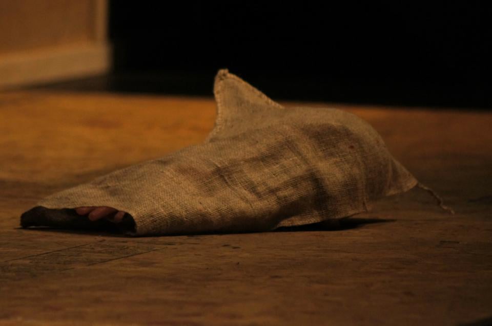Titus' hand and the head of his son lay discarded on the floor.                  