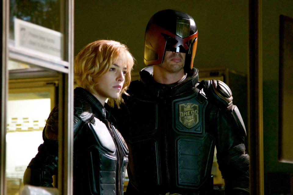 Judges Dredd (Karl Urban) and Anderson (Olivia Thirlby) serve as judge, jury and executioner in Director Pete Travis’s movie adaptation of the popular comic book series, “Judge Dredd.” 