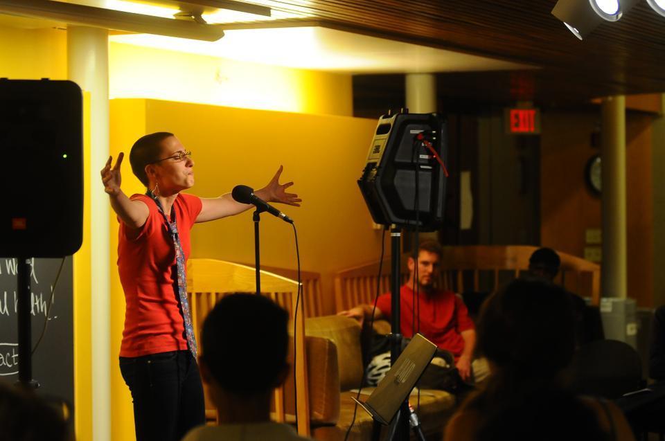 Cassandra E. Weston '14 recites a poem at Words on the Mind. Speakers passionately expressed experiences of loss, suicide, sexuality, pain, and separation through the spoken word.