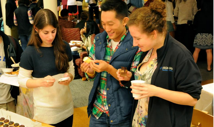 Rebecca A. Ruskin '13, president of the Harvard Culinary Society, enjoys bite-sized cupcakes from Kickass Cupcakes with her blockmates, Scott J. Yim '13 and Lina Lavitsky '13. The biannual food expo featured food samples and coupons from different restaurants in the Cambridge area, including Berryline, Tamarind Bay, Qdoba, and Finale's.