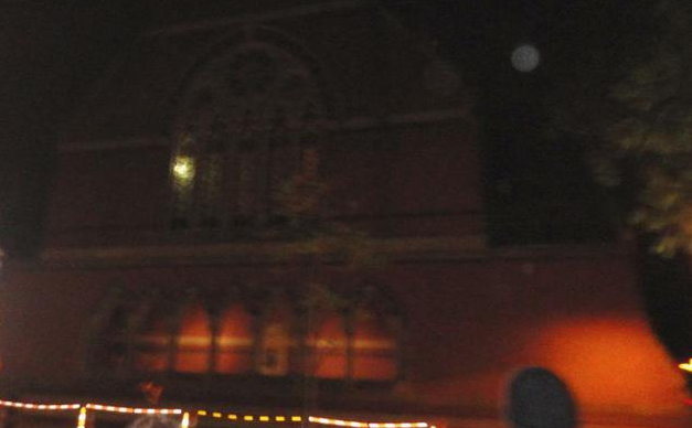 What is supposedly a ghost peeking through a window of Memorial Hall.