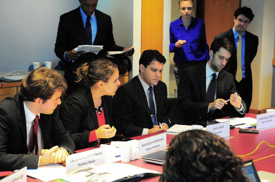 Harvard Kennedy School students and faculty participate in a national security crisis simulation Saturday in the Belfer Center. Each participant played the role of a Cabinet member or adviser as the group worked together to resolve a modern day crisis with Iran over possible nuclear test sites.