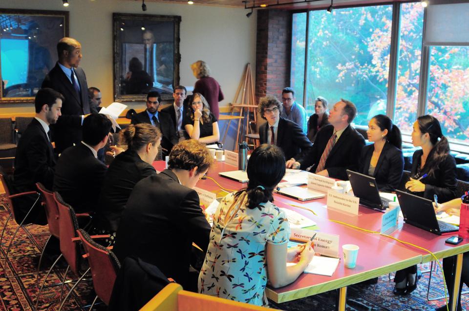 Harvard Kennedy School students and faculty participate in a national security crisis simulation Saturday in the Belfer Center. Each participant played the role of a Cabinet member or adviser as the group worked together to resolve a modern day crisis with Iran over possible nuclear test sites.