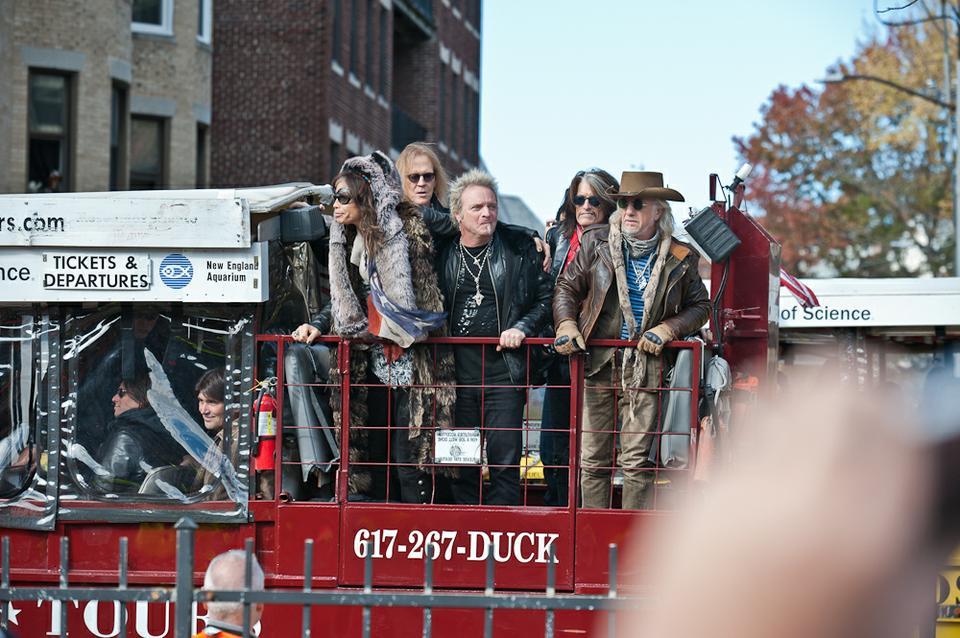 In full Boston fashion, Aerosmith was brought to their apartment dedication in a parade of Duck Boats.