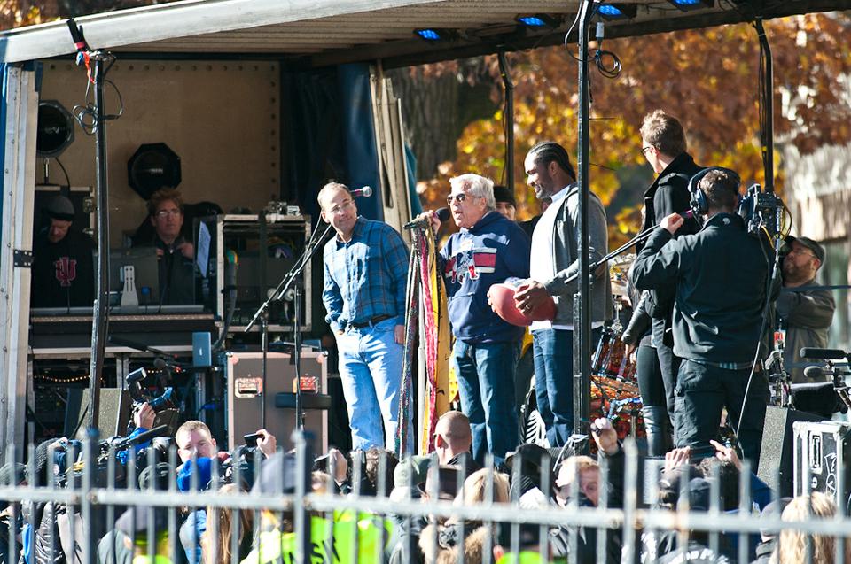 The Patriot's owner Robert Kraft along with JeRod Mayo and Tom Brady welcomed the band to a makeshift stage made on a flatbed truck and presented them with championship balls at their Allston apartment dedication. 