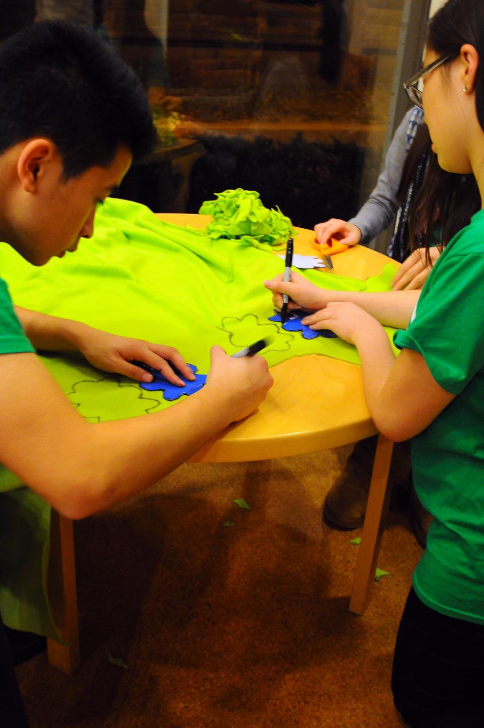 Students diligently stitch together hepatitis B virus plushys at Ticknor lounge on Monday night. Sophomore Rhed Shi, a member of Team HBV, notes the surprising fact that “the first anticancer vaccine was for HBV, yet even now it affects one in ten Asian Americans.” They hope to raise awareness for this preventable viral infection of the liver often transmitted at birth.