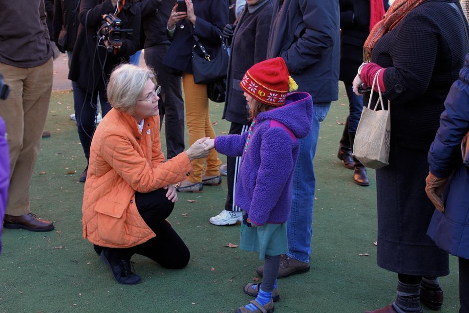 After casting her ballot at the Graham and Parks School polls this morning Elizabeth Warren greets Alexandra Morris, 6, who was waiting in line to vote with her parents. Morris introduced Warren to her My Little Pony action figure, Sophia.