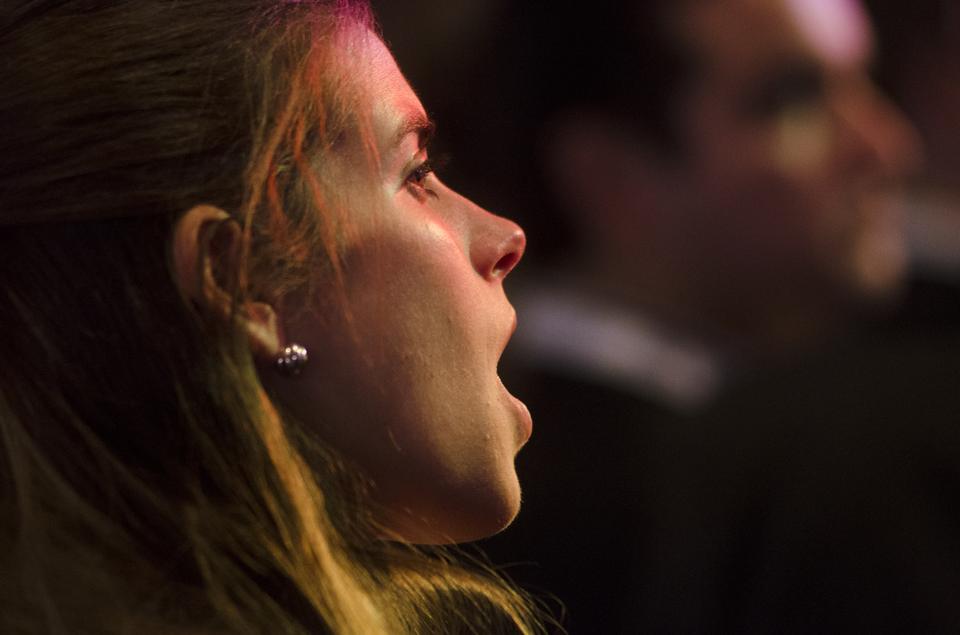 Romney supporter at the election rally at the Boston Convention and Exhibition Center reacts with shock when she learns her candidate lost the presidential election.