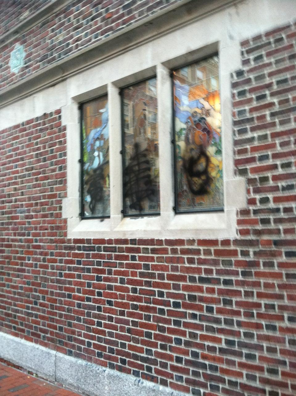 Graffiti on the window of the Harvard Lampoon, a semi-secret Sorrento Square social organization that used to occasionally publish a so-called humor magazine. 