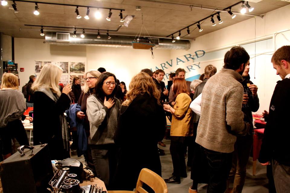 Guests admire the transformation of 92 Mount Auburn St. into the Harvard 'Labrary', a product of the Harvard Graduate School of Design's use of creativity with the intention to help libraries better serve the Harvard community. The Labrary, which featured books, technology, and innovative design, opened on Thursday evening. 