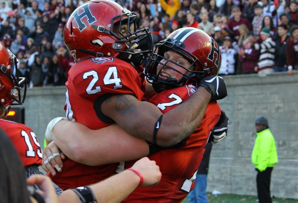 Senior running back Treavor Scales celebrates his game-clinching 63-yard touchdown run in the Harvard football team's 34-24 victory over Yale on Saturday at Harvard Stadium.