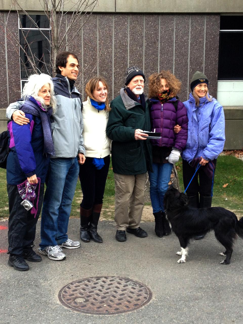 George H. Eastman, a former Harvard student and professor, celebrates his 81st birthday next to Harvard's Pooh Tree with his family. A philosopher, father, and long-time lover of A.A. Milne's Winnie-the-Pooh series, Eastman began caring for the tree in 1995, when he fashioned a small red door for the entryway.