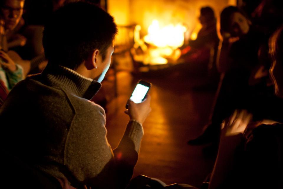 An Eliot House resident tries to connect to Facebook on his phone on Thursday. The afternoon blackout  caused many to turn to their smartphones for Internet.