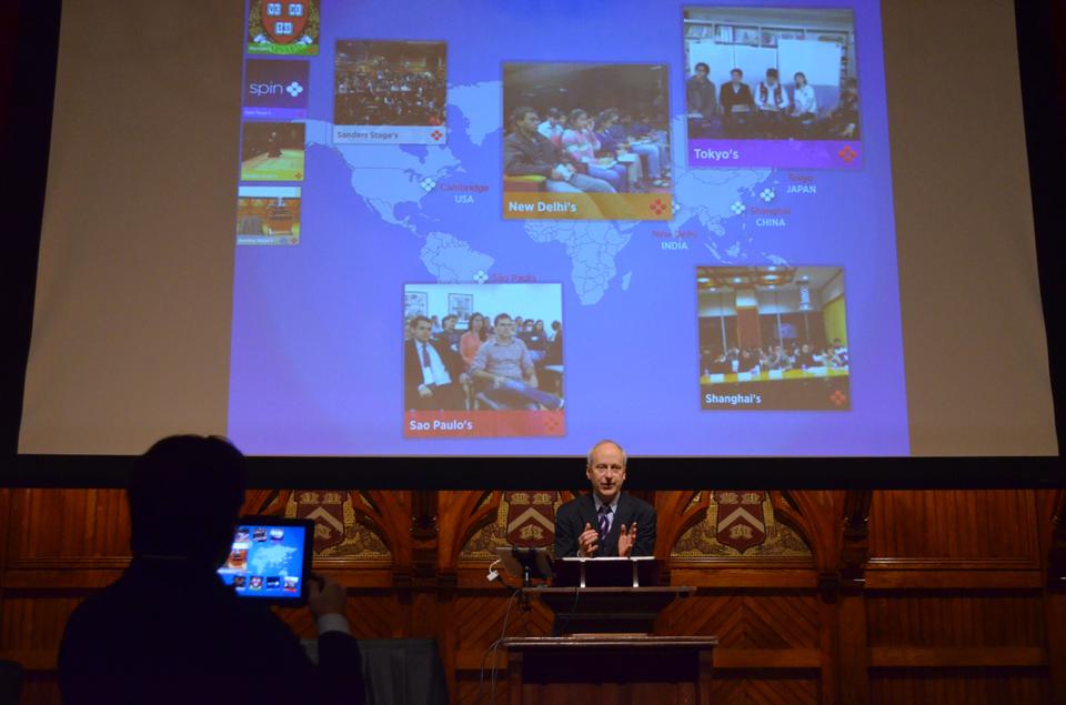 As part of an innovative educational experiment titled The Global Classroom, Government Professor Michael Sandel conducts lecture before students of the University of Shangai, Tokyo, Sao Paulo and New Delhi through a live, video‐linked class 
discussion. Harvard students in his "Justice" course had the opportunity to join this international discussion. 