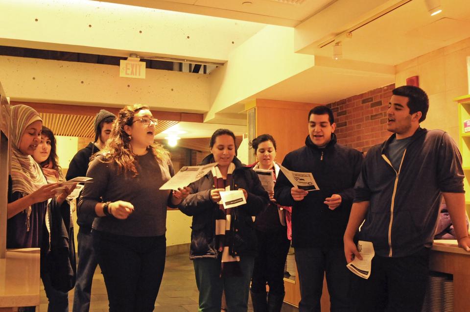 Members of the Harvard-Radcliffe Raza sing Monday night to Mather House dining hall staff. The group, drawn from the Latino community, traditionally performs Spanish-language carols throughout the residential houses to celebrate the holiday season.