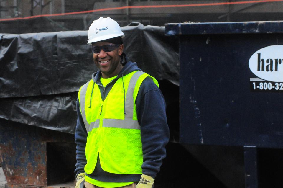 A Quincy construction worker is very happy to be working on such a wonderful remodeling project.