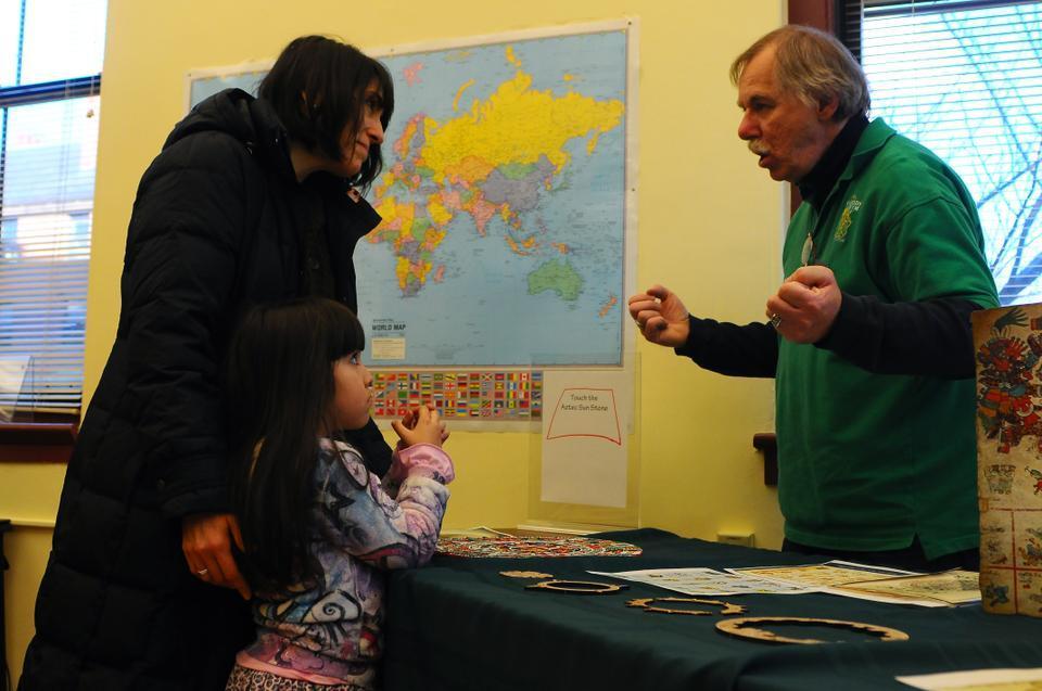 Will the world end on December 21st? "No, the Mayan calendar is simply starting over, just like ours does every January 1st," says Fred Surowiec. Fred explains the intricacies of the Aztec calendar to parents and children at the "Mesoamerican Calendars and 2012 Discovery Room" event at the Peabody Museum this past Saturday.