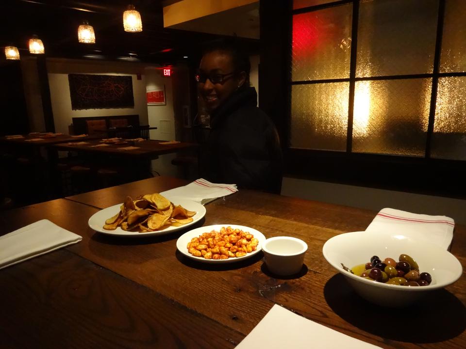 Snack offerings on tables in American Kitchen are meant to attract curious Cantabrigians for The Sinclair's opening week.
