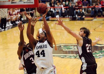 Losses to Princeton and Penn kept the Harvard men's basketball team from locking up its first ever outright Ivy League title earlier, but a victory by the Tigers over the Quakers in the final Ancient Eight contest of the season sent the Crimson dancing.