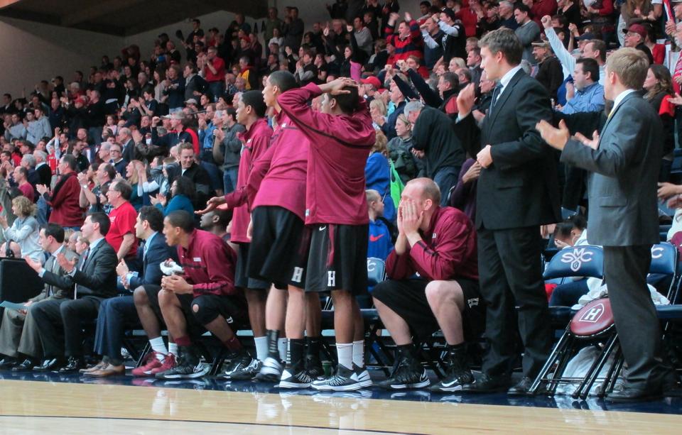 The Harvard bench looks in awe as Harvard gives up the lead in the final second of the Crimson's 70-69 loss to St. Mary's. Harvard finishes its California road trip 1-1.