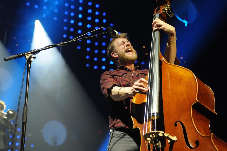 Ted Dwane shows off his upright base playing skills during their performance. Dwane taught himself how to place the base when he was just ten years old. 