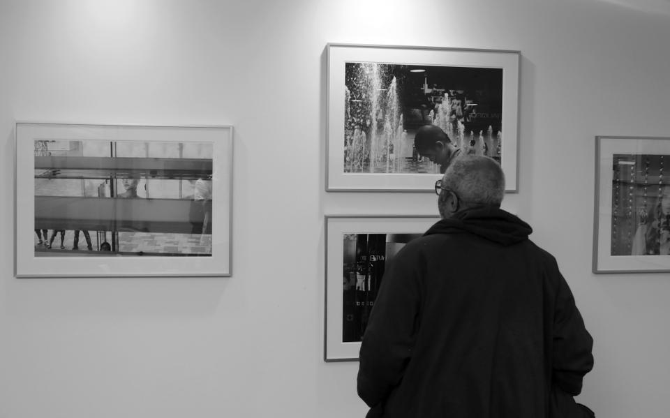 A man appreciates Adrian Gordon’s photographs on display in CGIS. The show "Photographs of China" opened on February 6th, and showcases the young, American photographer’s work. 