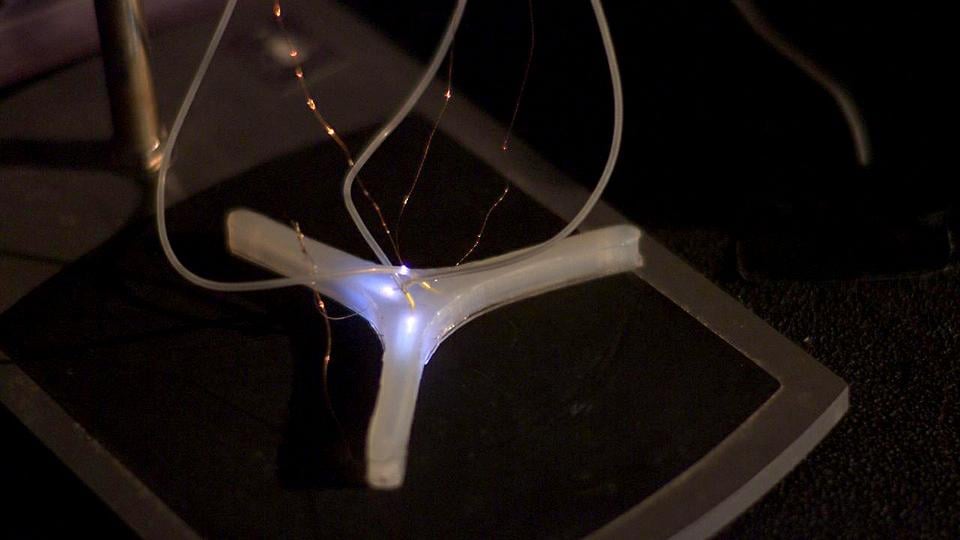 The ignition of combustible fuel within a soft robot is captured. Researchers in the Whitesides group are using the explosion of the gas to create rapid actuation of the robot allowing it to rapidly jump. 