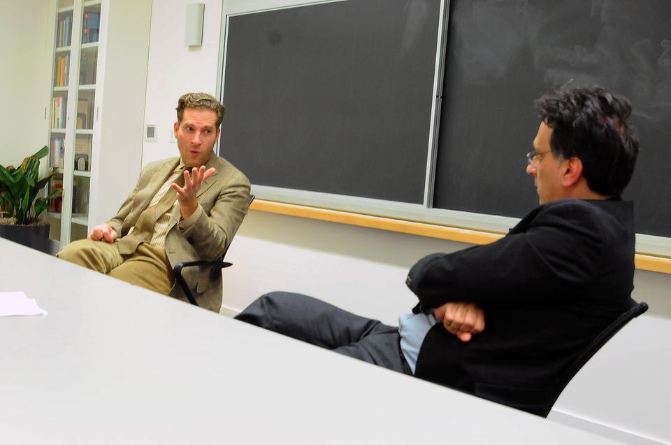 Moderator Roilos Panagiotis watches as Harvard Law School professor Noah Feldman discusses the rise of Salafi Islam among youth in Tunisia on Wednesday. His talk "The Politics of Islamic Cultures in the Wake of the Arab Spring" was sponsored by the Weatherhead Center for International Affairs.