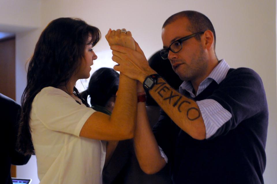 Kennedy School student Carlos Quintero writes “passion” on the arm of classmate Elisa DeAnda on Wednesday. Quintero and DeAnda’s messages were photographed as a part of the “Dear World Live” exhibition at the JFK Jr. Forum in the evening