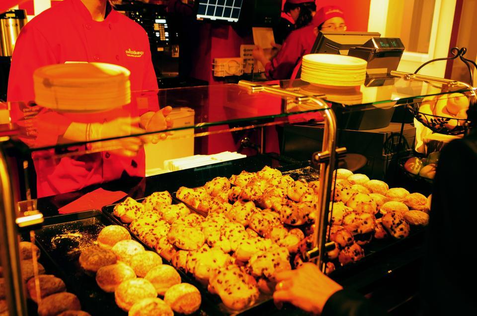 Co-entrepreneurs serve guests at the opening celebration of the Allston site of Swiss Bakery. The family-run bakery and cafe founded by Helene and Thomas Stohr opened its doors to the Allston and Cambridge community on Thursday evening.  