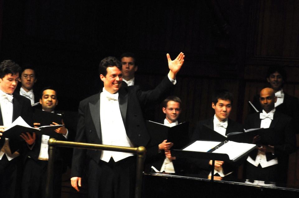 The Radcliffe Choral Society and Harvard Glee Club, led by conductor Andrew Clark pictured above, perform for the Junior Parents' Weekend Concert in Sanders Theatre in 2013.