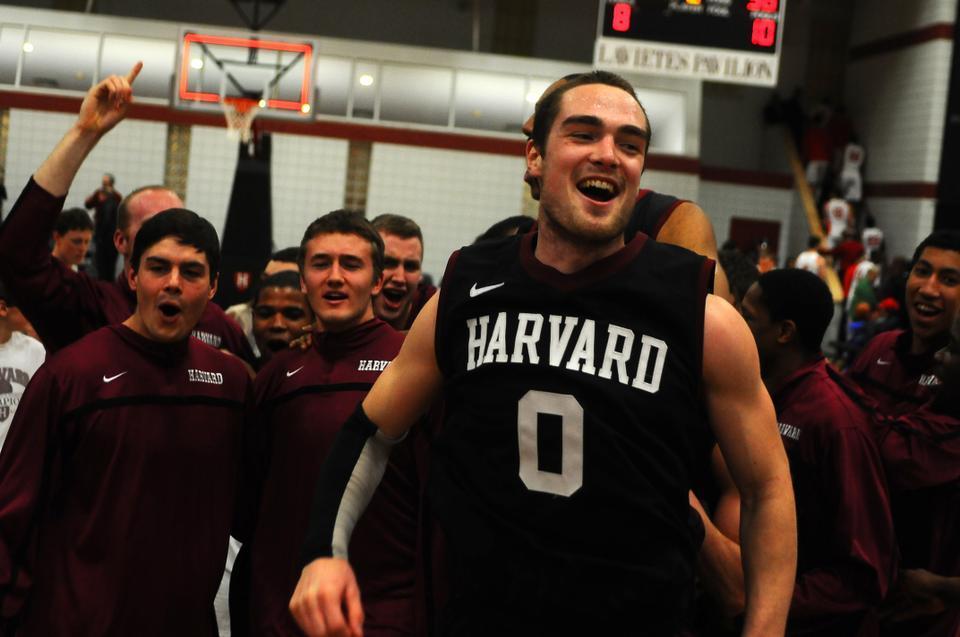 Junior co-captain Laurent Rivard celebrates following the Harvard men's basketball team's 65-56 victory over Cornell on Saturday night at Lavietes Pavilion. The victory, coupled with Princeton's 80-67 loss to Brown, earned the Crimson its second straight trip to the NCAA tournament.