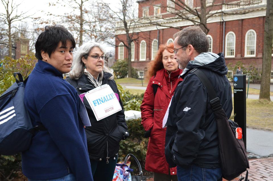 Members of The Harvard Union of Clerical and Technical Workers gather in front of Massachusetts Hall on Tuesday afternoon.  They were celebrating the new contract made with the University, which ended the longest negotiations in the union's history.   