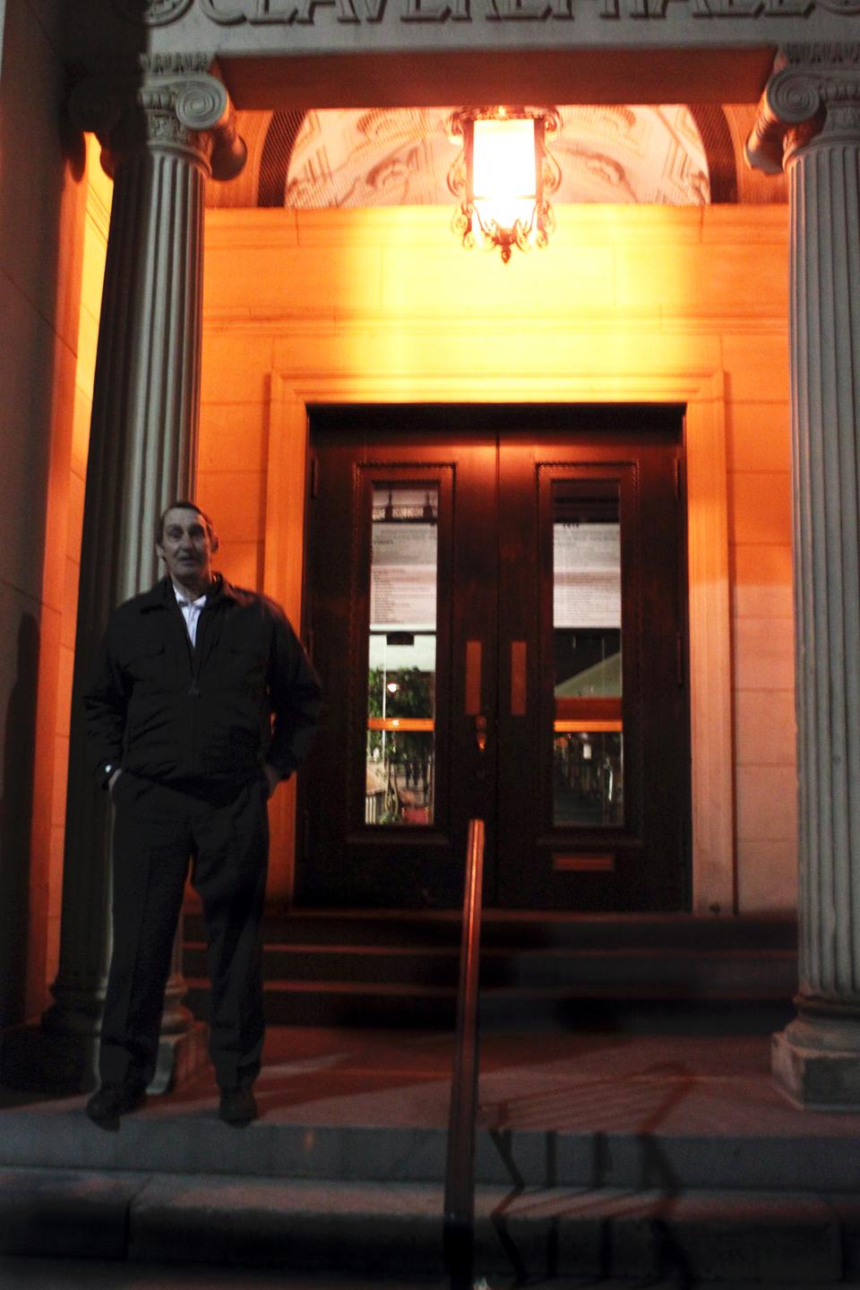 A Securitas officer stood outside Claverly Hall to prevent freshmen from entering Adams House during 2013 River Run festivities.