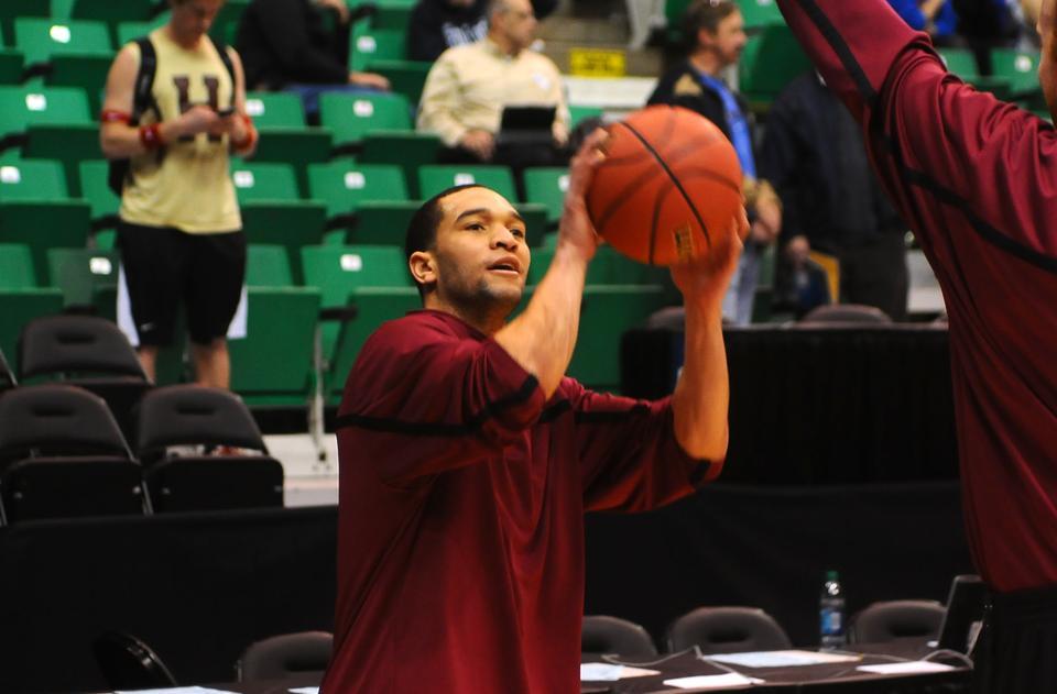 Co-captain Christian Webster warms up before the Harvard men's basketball team's matchup against the University of Arizona in the third round of the NCAA tournament.