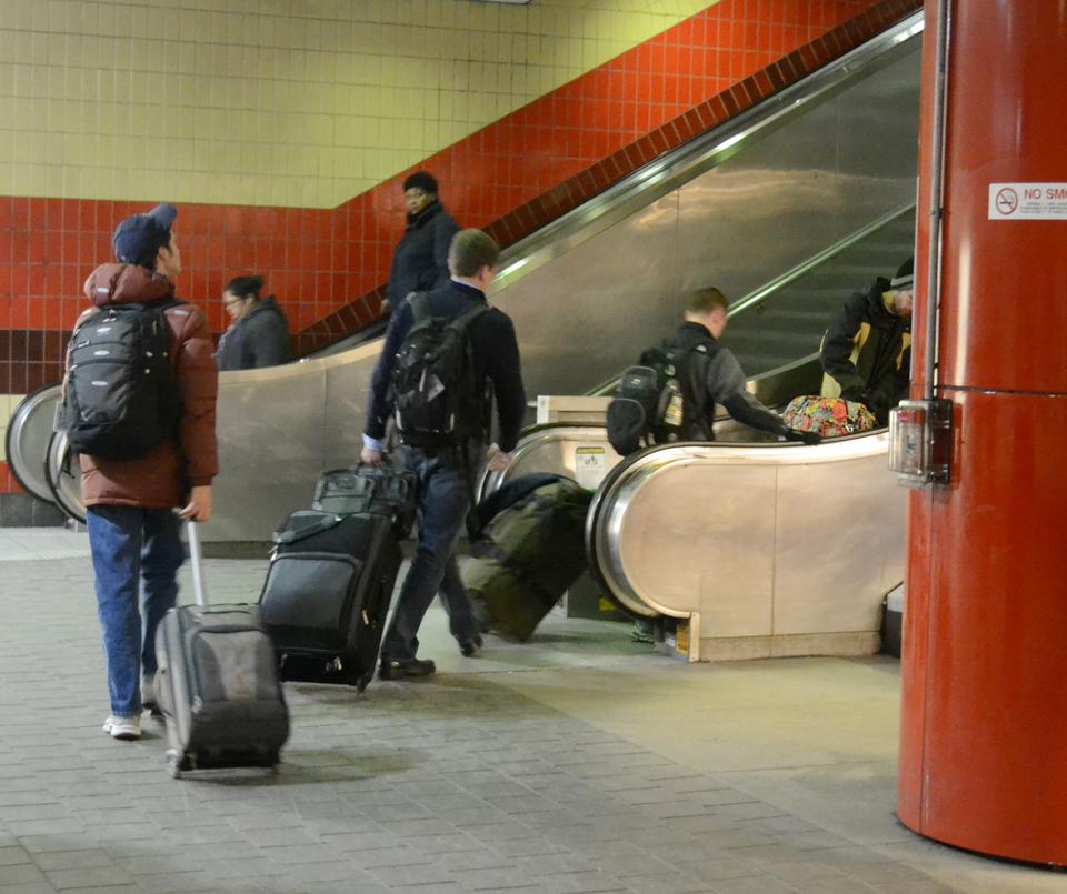 Harvard students take advantage of the free MTBA services from the airport as they return from Spring Break. Many flights were delayed or cancelled due to the winter storm Virgil.