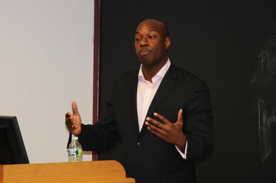 Hakeem Rahim '02 speaks at the mental health forum in Sever Wednesday night.  He spoke about his struggles as an undergraduate with bipolar disease. 