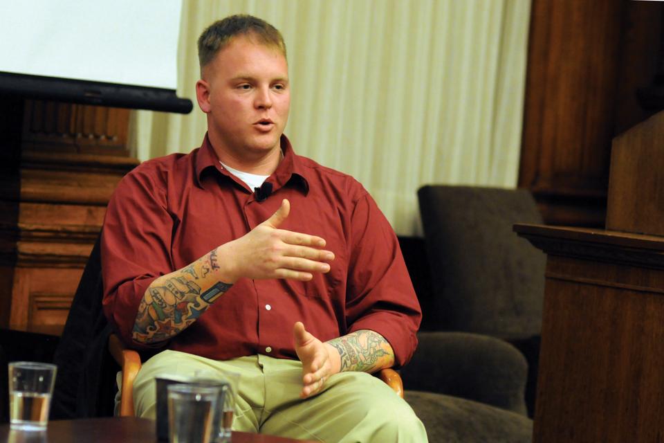 Retired U.S. Marine Corps Sgt. Thomas James Brennan discusses overcoming PTSD after serving in Afghanistan, Monday evening in the Barker Center. Brennan and his co-panelist, Nieman fellow and photojournalist Finbarr O’Reilly, also spoke of their upcoming book about the development of their friendship and the repercussions of psychological trauma upon their return from the war.